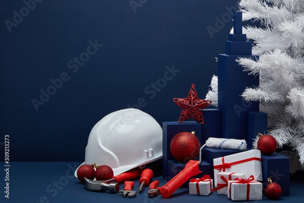 Obraz Construction tools, hard hat and Christmas decorations. Christmas and New Year construction