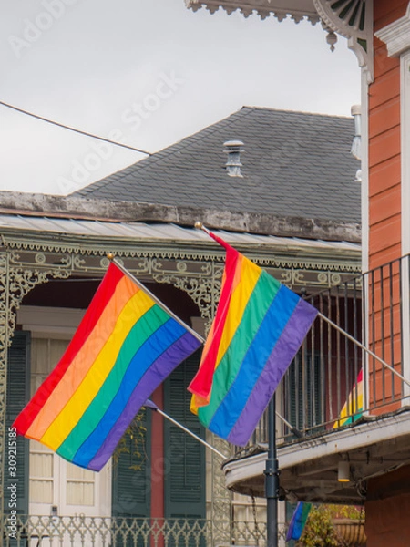Obraz Rainbow gay pride flag in the middle of the french quarter in New Orleans, USA.