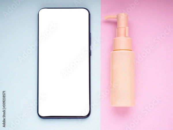 Fototapeta Mock up blank empty smart phone screen on pink beige fashion cosmetic feminine accessory gifts sale flat lay background, online app shopping in mobile ecommerce technology concept, vertical top view