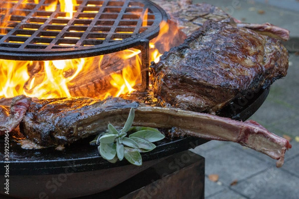 Obraz Tomahawk rib steak on hot grill