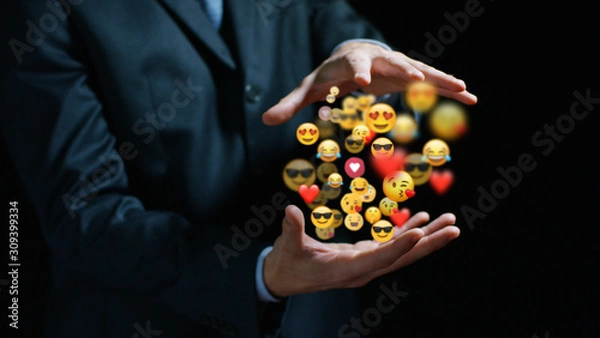 Fototapeta Close up of business man is showing positive anonymous remake positive icons holograms in his hands.