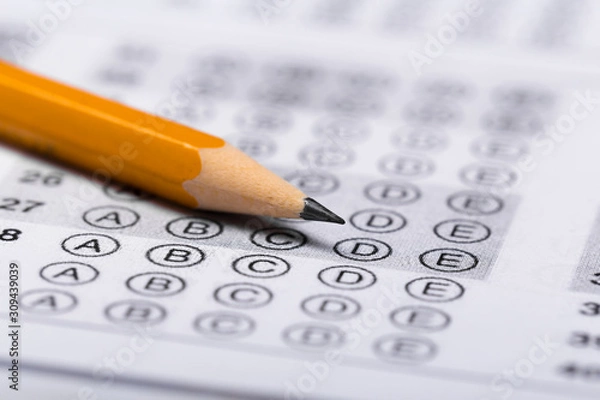 Fototapeta Fill in the answer sheet in the exam with a pencil