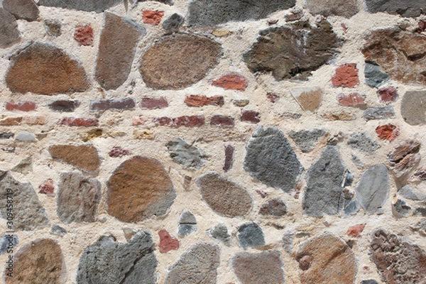 Obraz Rough weathered sandstone wall surface texture close up