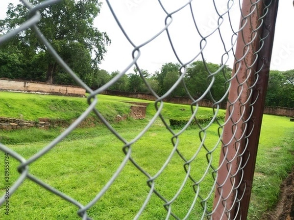 Fototapeta football net on the fence