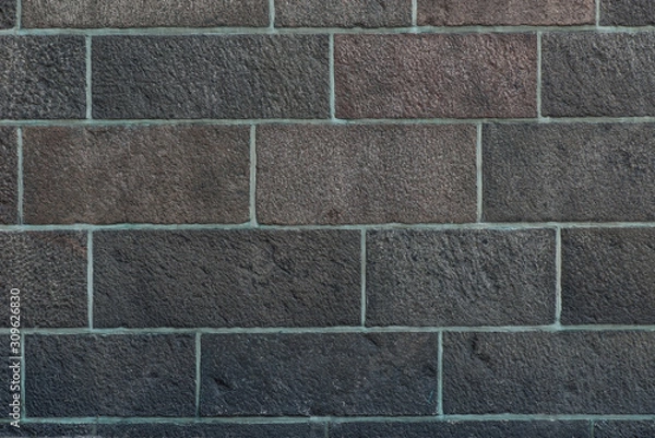 Fototapeta Texture of a stone wall. Old castle stone wall. Stone wall as a background or texture. Rock texture