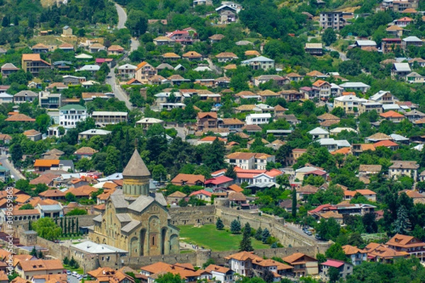 Fototapeta Panoramic view of Mtskheta, The Old Town Lies At The Confluence Of The Rivers Mtkvari And Aragvi. Svetitskhoveli Cathedral, Ancient Georgian Orthodox Church