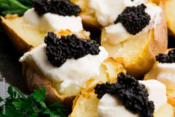 Fototapeta Baked potato with spiced cream cheese and caviar