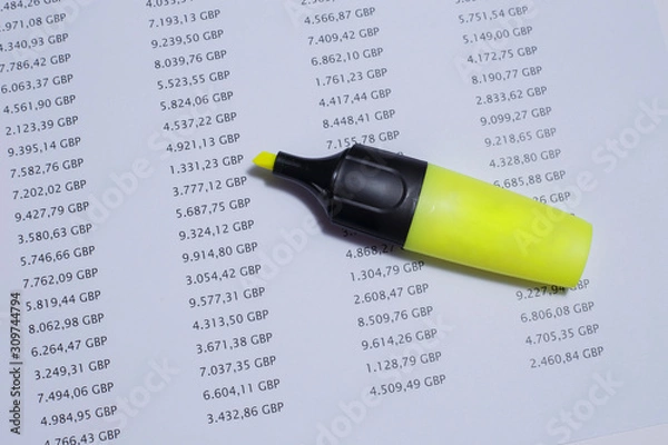 Fototapeta Financial spreadsheet on United Kingdom pounds, showing amounts of money with a yellow marker.