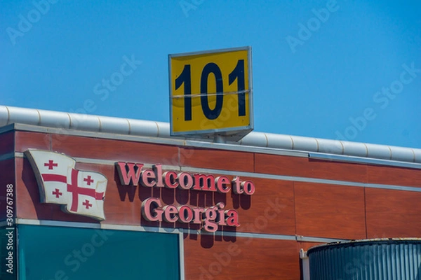 Fototapeta TBILISI, GEORGIA. JULY 24, 2019. Tbilisi welcome sign at the gate apron Tbilisi International