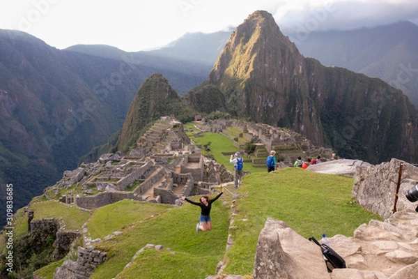 Fototapeta Jackie jumping for joy at Machu Picchu