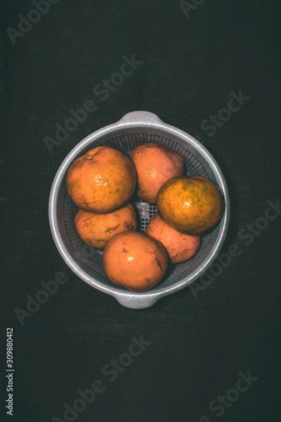 Obraz Oranges in silver bucket
