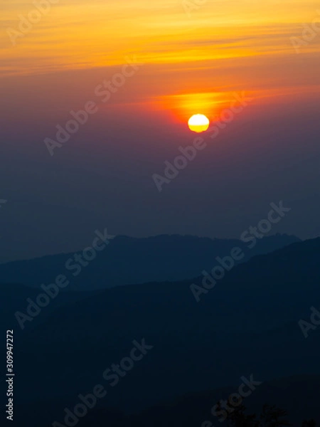 Obraz dramatic sunset over cloudy sky.