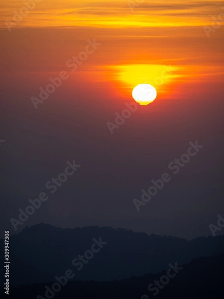 Obraz dramatic sunset over cloudy sky.