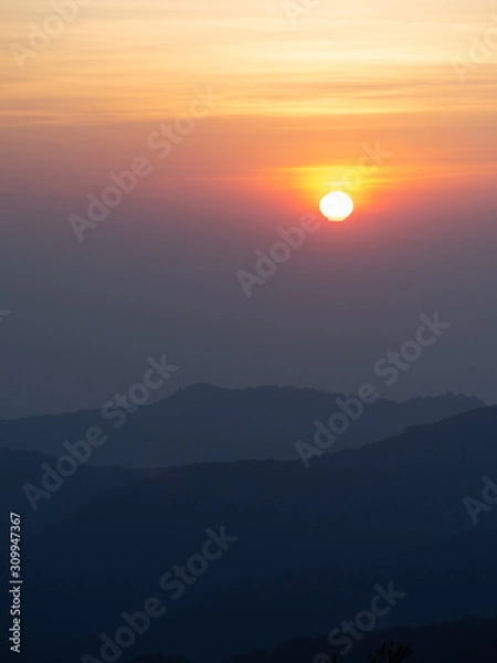Obraz dramatic sunset over cloudy sky.