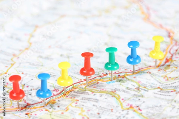 Obraz push pins fixed in a road map with copy space for your text