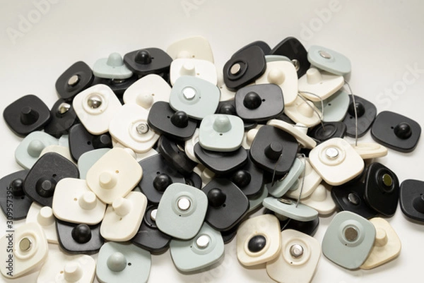 Obraz many multi-colored anti-theft sensor on a light background