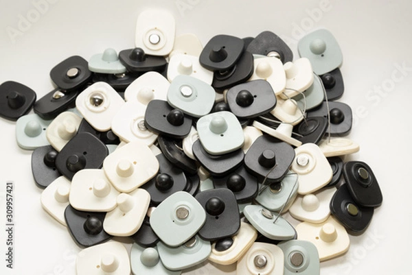 Obraz many multi-colored anti-theft sensor on a light background