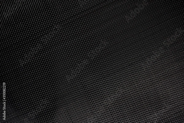 Fototapeta Texture of diagonal and rectangular metal lattice fine weave lattice on black background