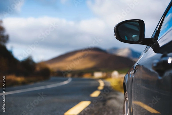 Fototapeta black car on road at mountain