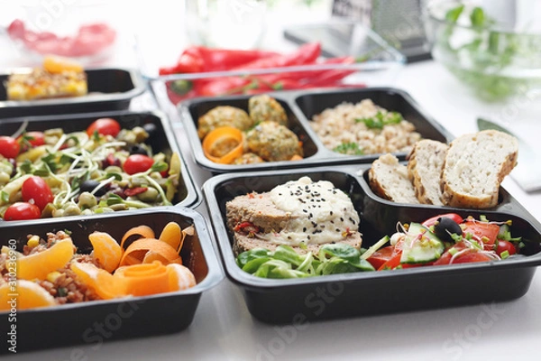 Fototapeta Catering. Meal prep. A meal in a box. A healthy box diet.