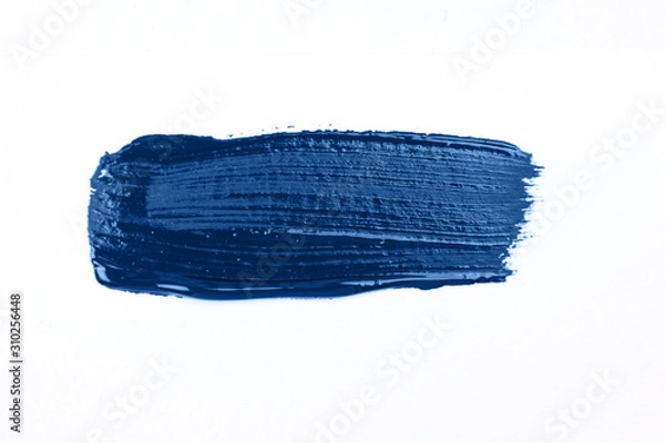 Fototapeta Blue stroke of the paint brush isolated on white. Classic blue color of year 2020