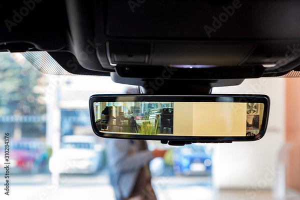Fototapeta Rear view mirror in modern car with camera and display