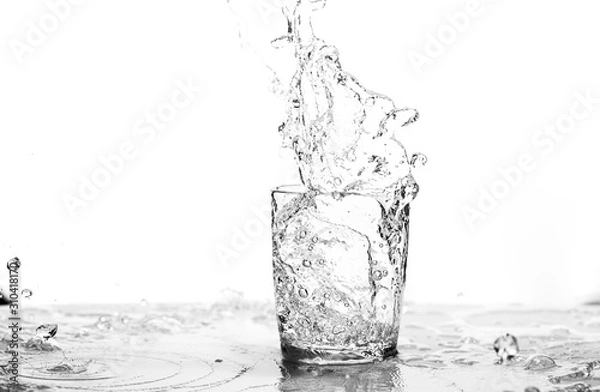 Fototapeta water in its element, in black and white, isolated, creating spalsh, and beautiful form 
