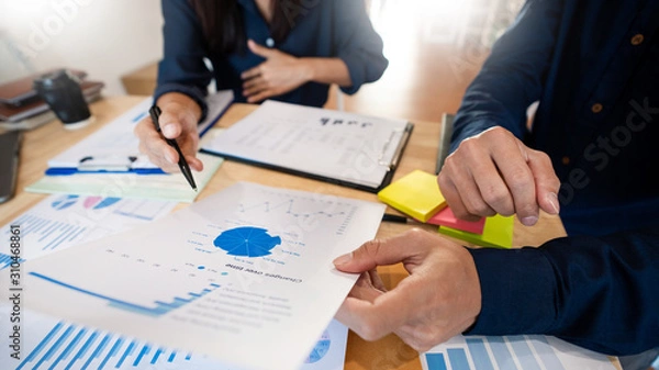 Fototapeta Business People Talking Discussing with coworker planning analyzing financial document data charts and graphs in Meeting and successful teamwork Concept.