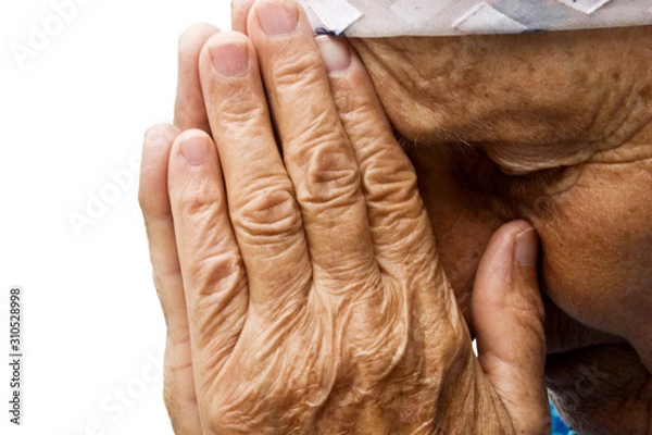 Fototapeta Grandma asking for help. Old grandmother praying to the Almighty