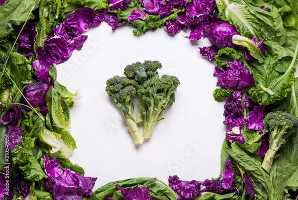 Obraz Broccoli framed by lettuce and cabbage