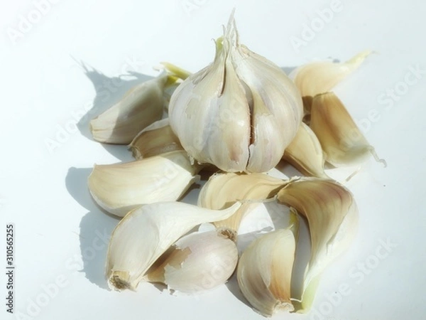Obraz Garlic cloves on a white background