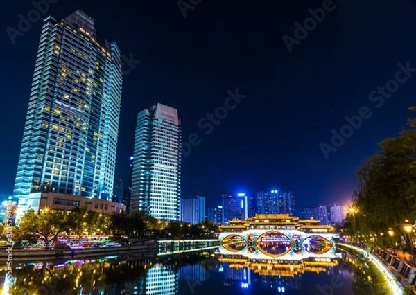 Fototapeta Night city view near the Anshun bridge in Chengdu, Sichuan, China. 
 Modern skyscrapers in Chinese metropolis city.