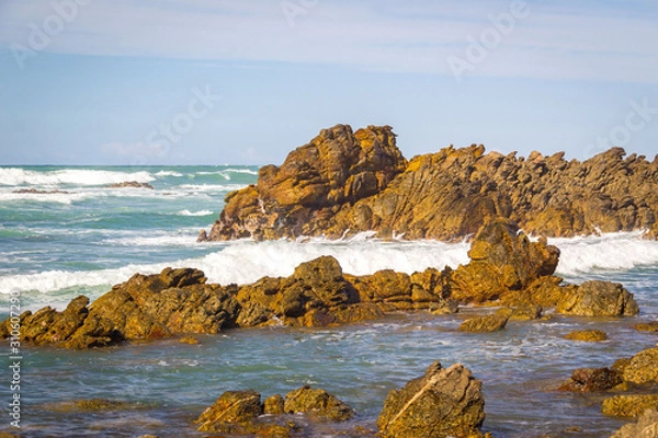 Fototapeta Cape Agulhas (also known as Cape of the Needles) - the southern-most tip of Africa, rocky coastline where Atlantic and Indian Oceans meet