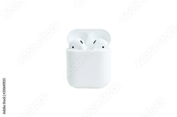 Fototapeta White wireless bluetooth headphones lie on a white background. The concept of modern technology, gadgets. Convenience of wireless headphones. Minimalism, close-up. Isolate