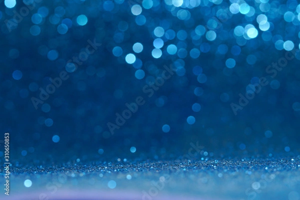 Fototapeta blue Sparkling Lights Festive background with texture. Abstract Christmas twinkled bright bokeh defocused and Falling stars. Winter Card or invitation	