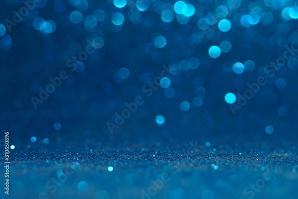 Fototapeta blue Sparkling Lights Festive background with texture. Abstract Christmas twinkled bright bokeh defocused and Falling stars. Winter Card or invitation	