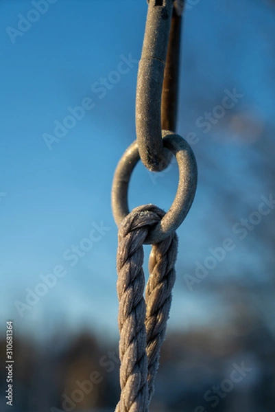 Obraz rusty chain on blue background