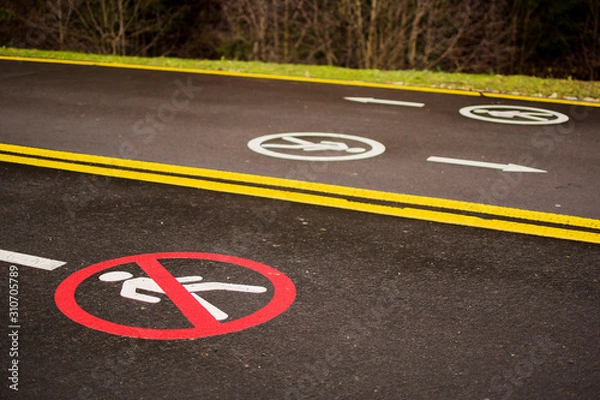Fototapeta No Pedestrian Crossing Traffic Sign on modern wide smooth empty asphalt highway street stretching to horizon. Speed, safety, comfortable journey and professional road building concept.
