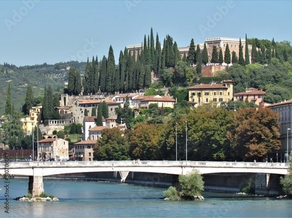 Fototapeta View of Verona Streets and Architecture. The Beautiful city of Romeo and Julietta shows its beauty full of details and history. Towers (Torre di Lamberti), Bridges (Ponte di Castelvecchio).