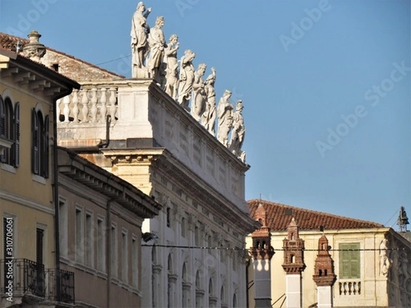 Fototapeta View of Verona Streets and Architecture. The Beautiful city of Romeo and Julietta shows its beauty full of details and history. Towers (Torre di Lamberti), Bridges (Ponte di Castelvecchio).