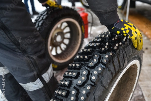 Fototapeta closeup of a racing tire with studs.