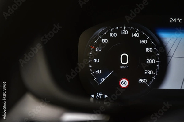 Obraz Speedometer in black background and traffic sign recognition system.