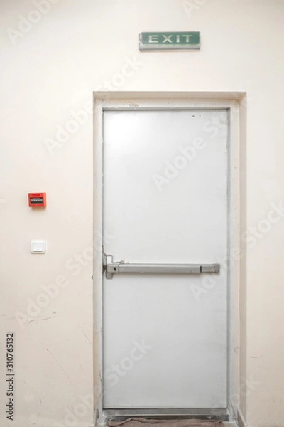 Fototapeta Fire exit door in condominium or apartment for emergency fire alarm Isolated on white