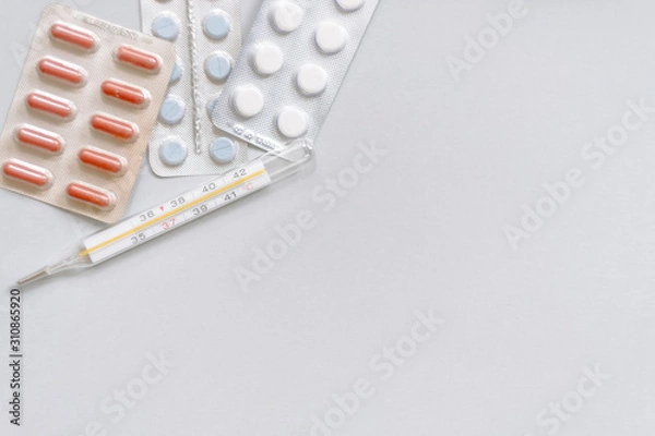 Fototapeta Tablets in packs. Tablets on a light background. Different types of pills