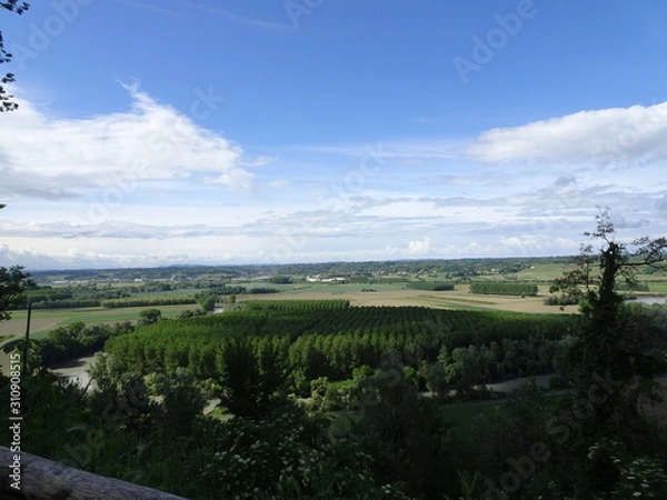 Fototapeta Valley panorama with river and cultivated fields - View from a wood of a river