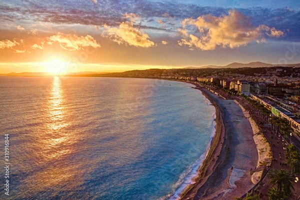 Obraz Impressive sunset view of Nice sea waterfront from the castle hill, with tumultuous sky and clouds, and warm light
