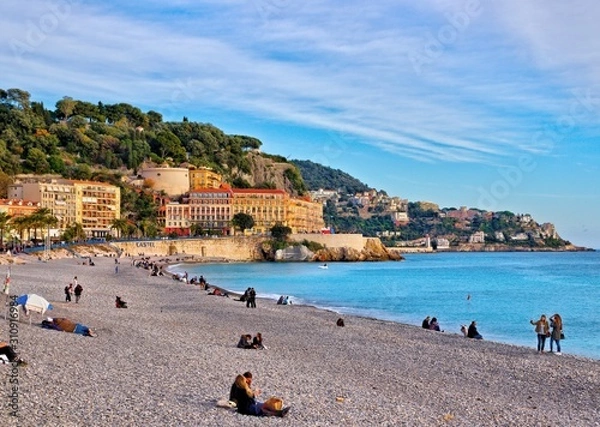Obraz Nice, France - December 1, 2019: view of the beach and walkway promenade on a clear winter day