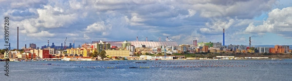 Obraz Building for the covering of mineral deposits in the Arcelormittal company (formerly Ilva) in the industrial area of Taranto, on the outskirts of the city and Tamburi district
