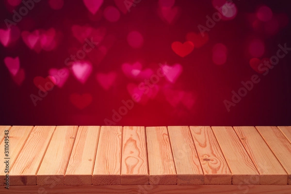 Fototapeta Empty wooden table over bokeh heart shape background. Valentines day concept celebration.