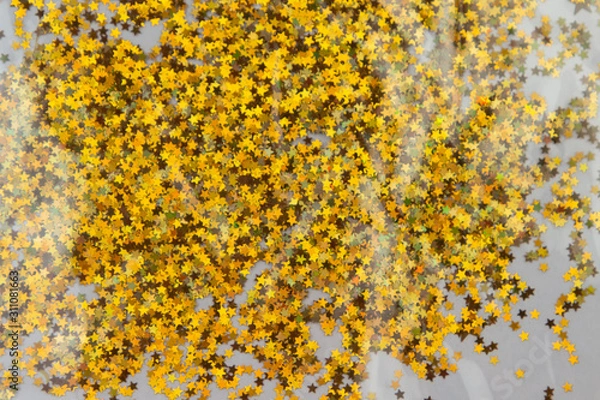 Obraz Gold sparkle glitter background. Glittering sequins stars wall.